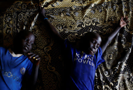 Ruai Mario, 10 (L) and his brother Machiey Mario, 8, rest on a bed in their home at the United Nations Mission in South Sudan (UNMISS) Protection of Civilian site (CoP) in Juba, South Sudan, February 15, 2017. REUTERS/Siegfried Modola