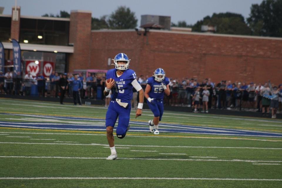 CovCath QB Evan Pitzer runs for a first down as Covington Catholic defeated Beechwood 31-14 Sept. 16, 2022.
