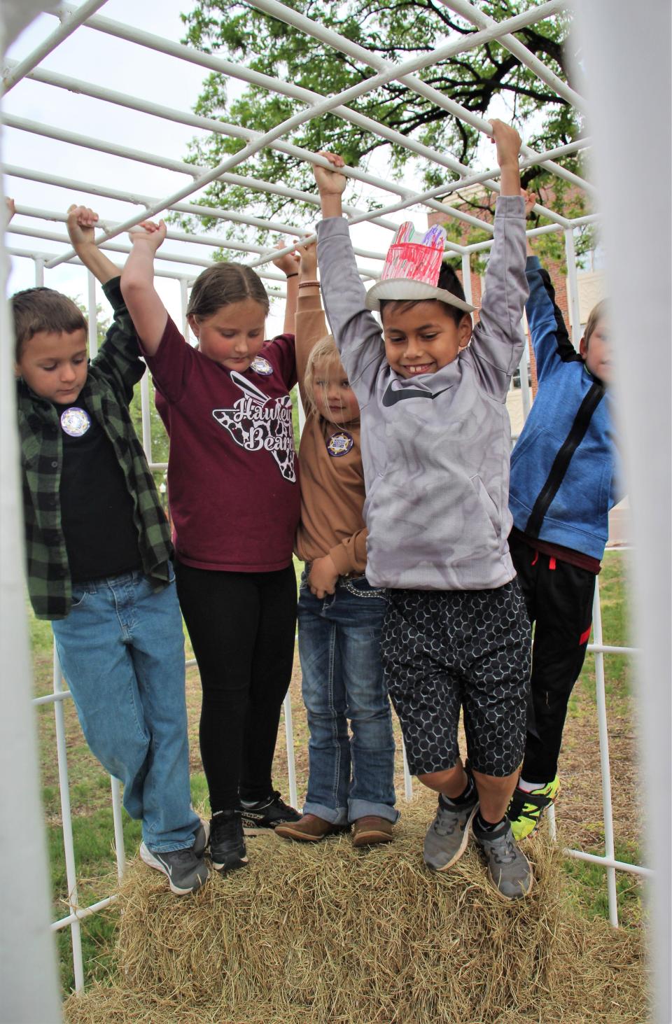 Hawley first-graders got to hang out a few minutes at the jail at HSU's Western Heritage Day Thursday. To get out, they had to promise the jailer "I will never come back again!"