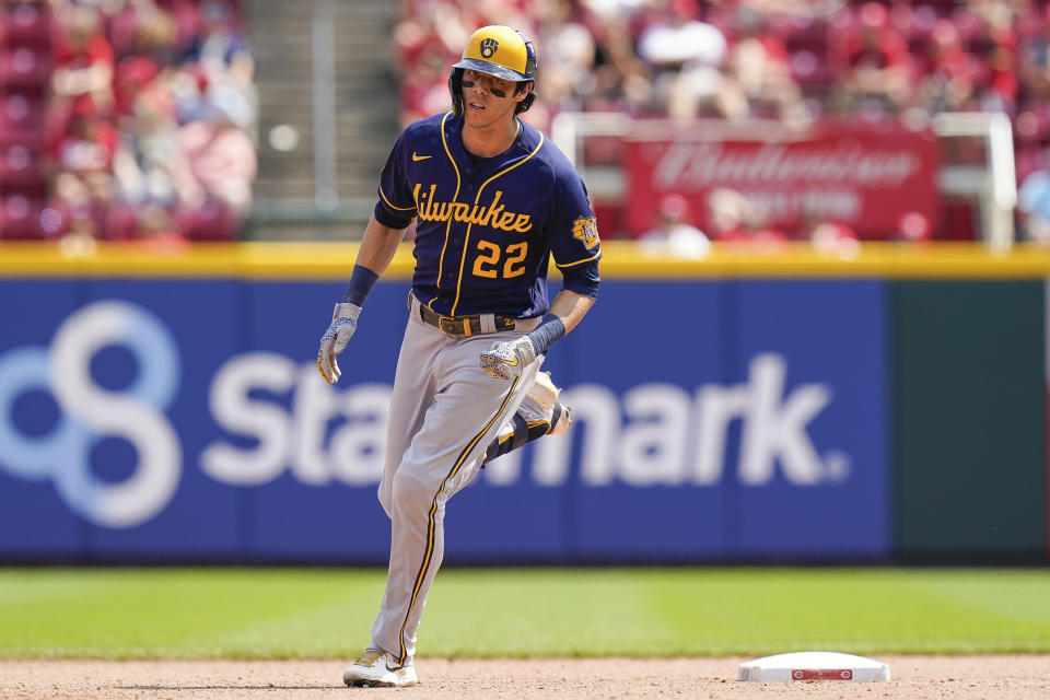 Milwaukee Brewers' Christian Yelich (22) runs the bases after hitting a home run during the seventh inning of a baseball game against the Cincinnati Reds in Cincinnati, Sunday, July 18, 2021. (AP Photo/Bryan Woolston)