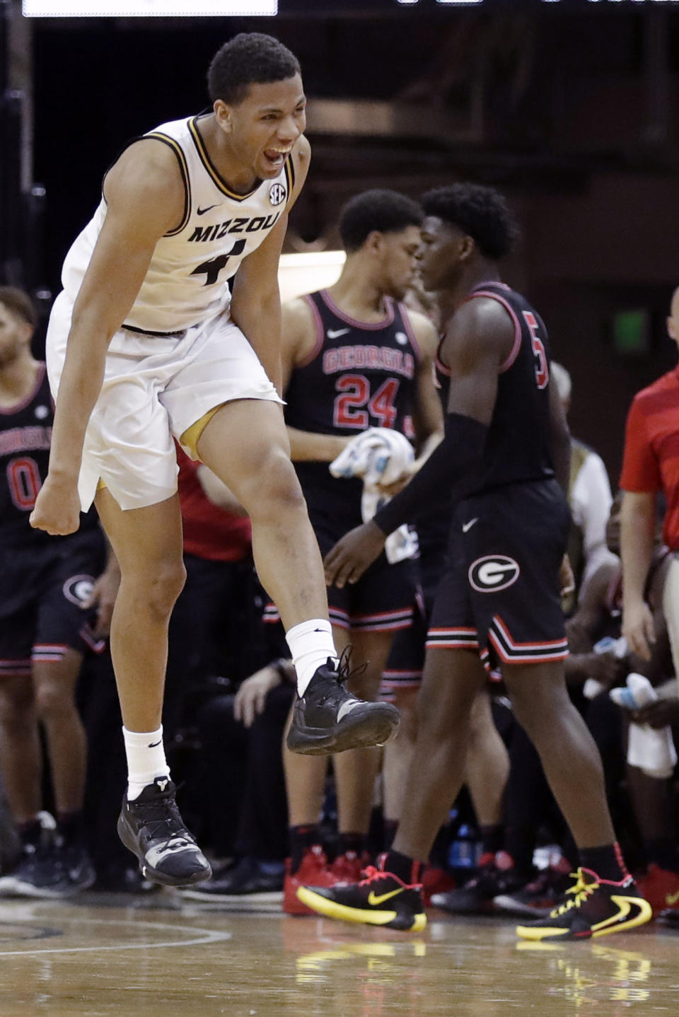 Missouri's Javon Pickett, left, celebrates the team's 72-69 victory as Georgia's Anthony Edwards, right, heads off the court following an NCAA college basketball game Tuesday, Jan. 28, 2020, in Columbia, Mo. (AP Photo/Jeff Roberson)