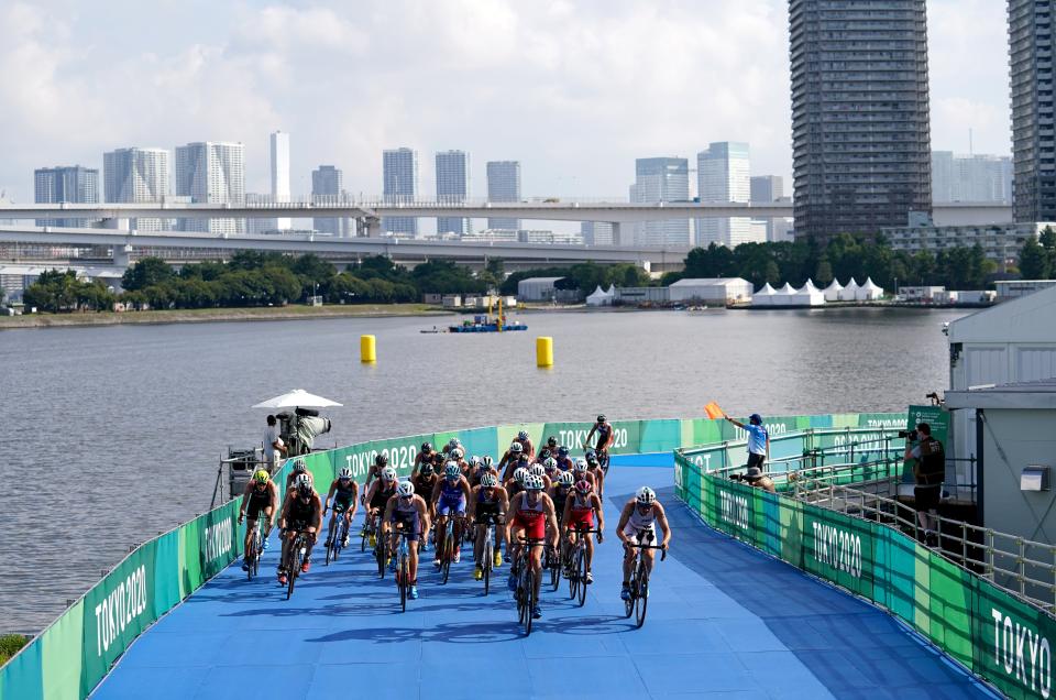 A big group formed on the bike (Martin Rickett/PA) (PA Wire)