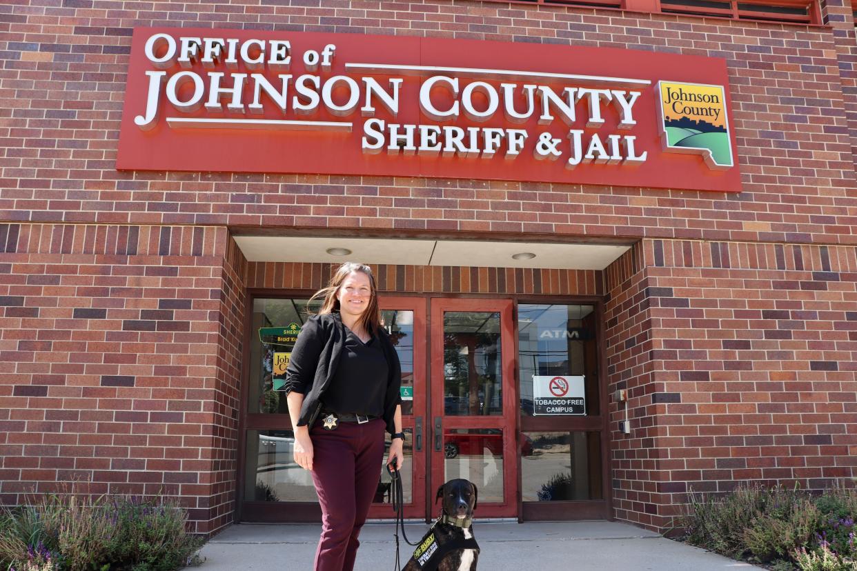 Rudy and Detective Sgt. Alissa Schuerer pose for a photo in front of the Johnson County Sheriff's Office on Thursday, Aug. 17, 2023.