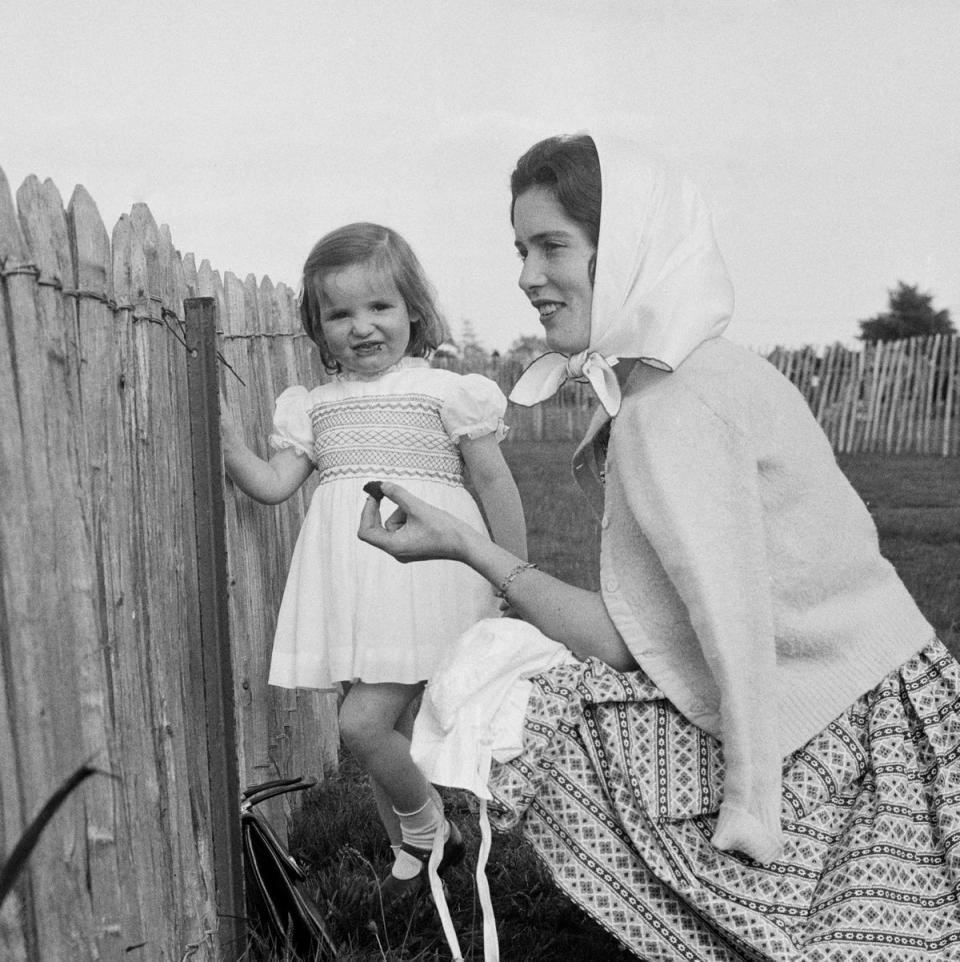 Susan Ferguson (later Barrantes, 1937 - 1998) watching a polo match with daughter Jane on June 1st, 1960 (Getty Images)