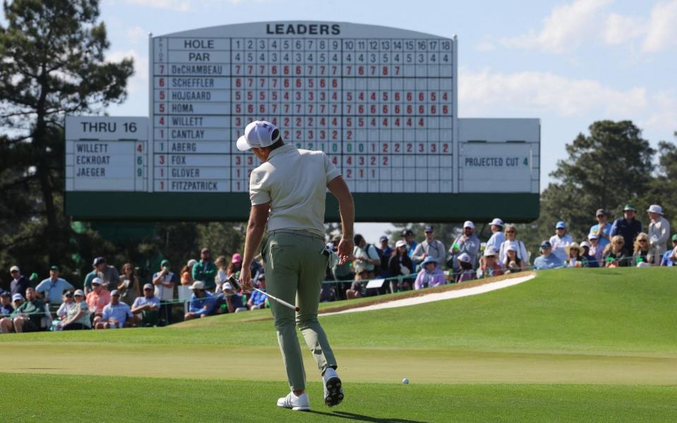 England's Danny Willett watches his putt from off the green on the 17th hole