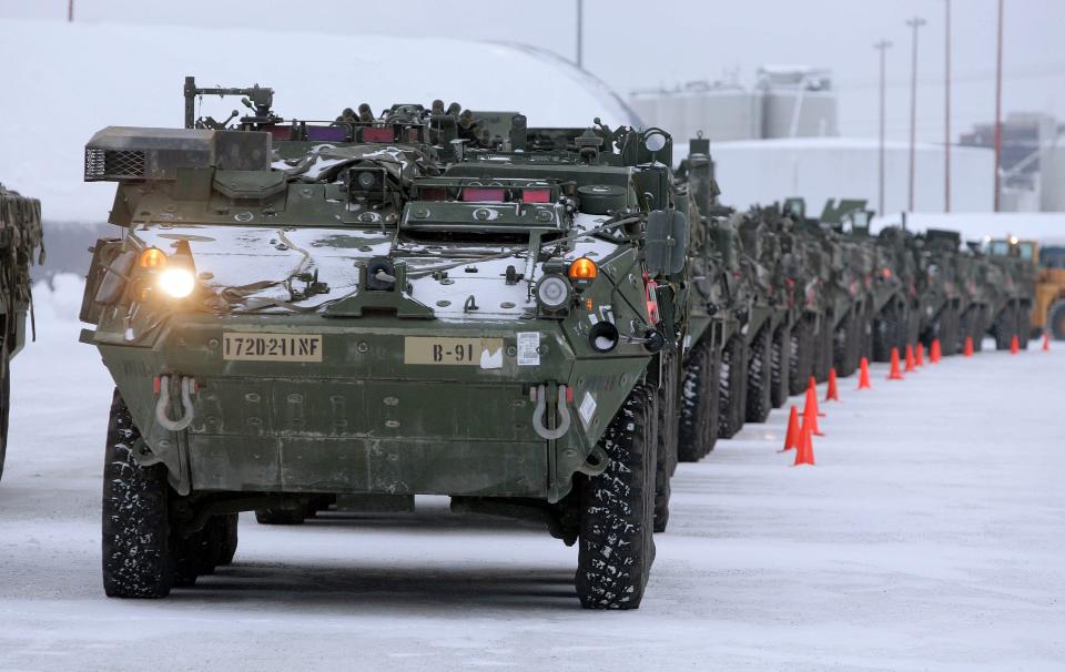 Stryker vehicles sit in a storage yard at the Port of Anchorage in Alaska, awaiting transport to Fort Wainwright, after a deployment.