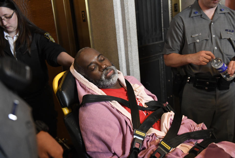 A protester who became unresponsive while being arrested by state police is helped by medical personnel as tenants and members of the Upstate Downstate Housing Alliance from across the state, demand New York Gov. Andrew Cuomo and state legislators pass universal rent control legislation that would strengthen and expand tenants rights across the state of New York before rent laws expire on June 15th during a protest rally at the state Capitol Tuesday, June 4, 2019, in Albany, N.Y. (AP Photo/Hans Pennink)\