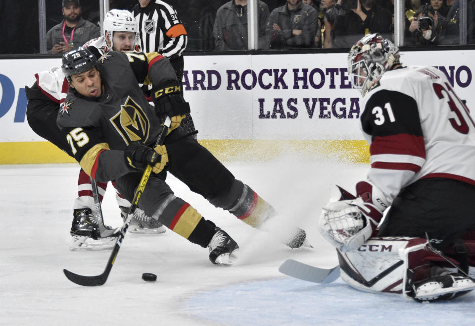 Vegas Golden Knights right wing Ryan Reaves (75) shoots against Arizona Coyotes goaltender Adin Hill during the second period of an NHL hockey game Saturday, Dec. 28, 2019, in Las Vegas. (AP Photo/David Becker)