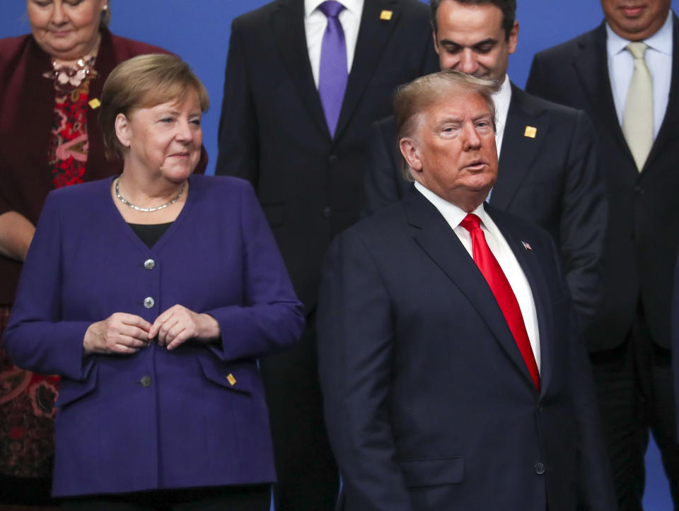 US President Donald Trump (right) and German chancellor Angela Merkel (left) during the annual Nato heads of government summit at The Grove hotel in Watford, Hertfordshire.