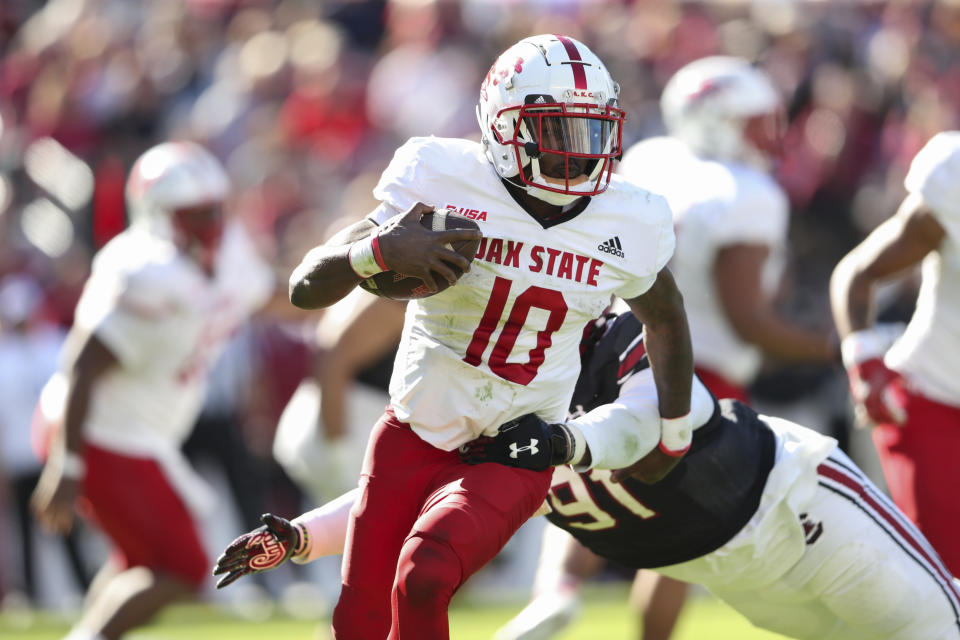 Jacksonville State quarterback Zion Webb (10) pulls away from South Carolina defensive tackle Tonka Hemingway (91) during the second half of an NCAA college football game on Saturday, Nov. 4, 2023, in Columbia, S.C. (AP Photo/Artie Walker Jr.)