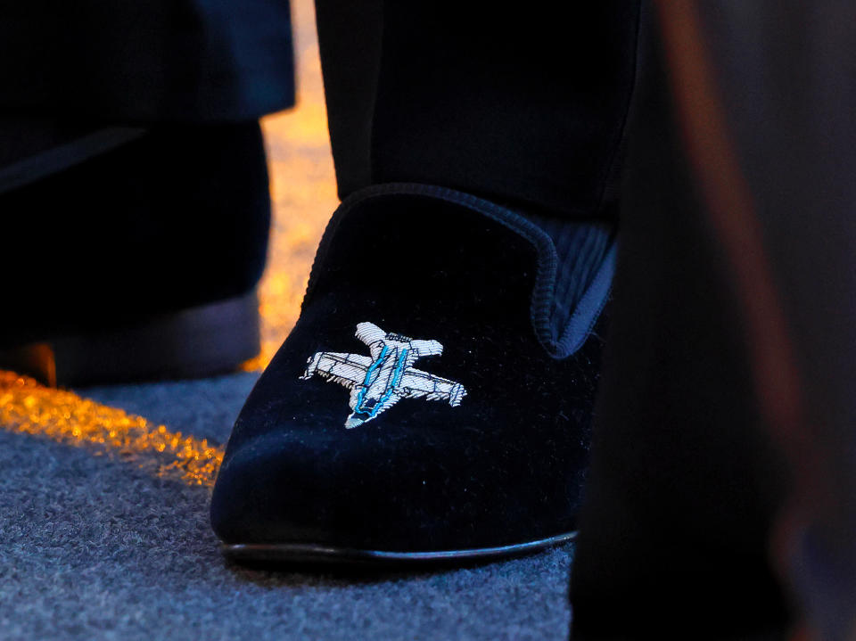 LONDON, UNITED KINGDOM - MAY 19: (EMBARGOED FOR PUBLICATION IN UK NEWSPAPERS UNTIL 24 HOURS AFTER CREATE DATE AND TIME) Prince William, Duke of Cambridge, wearing a pair of velvet evening slippers embroidered with a fighter plane design, attends the UK premiere and Royal Film Performance of 'Top Gun: Maverick' in Leicester Square on May 19, 2022 in London, England. (Photo by Max Mumby/Indigo/Getty Images)