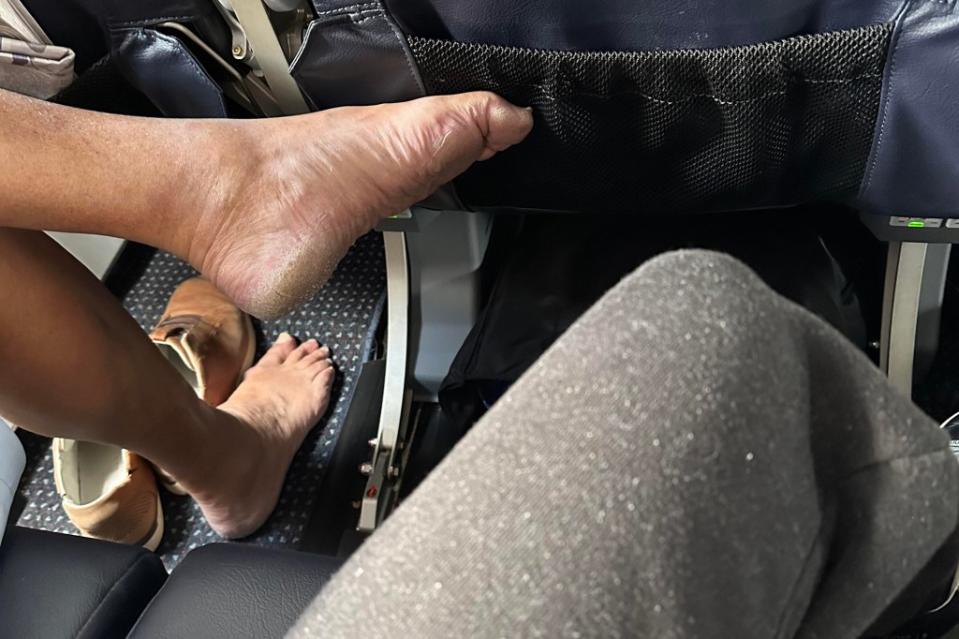 A furious flier has taken to Reddit to rage at a rude man who sat next to them on a recent plane ride, shamelessly shoving his bare feet into their personal space. Reddit / mildlyinfuriating