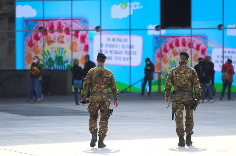 Italian army soldiers patrol streets after being deployed to the region of Lombardy to enforce the lockdown against the spread of coronavirus disease (COVID-19) in Milan