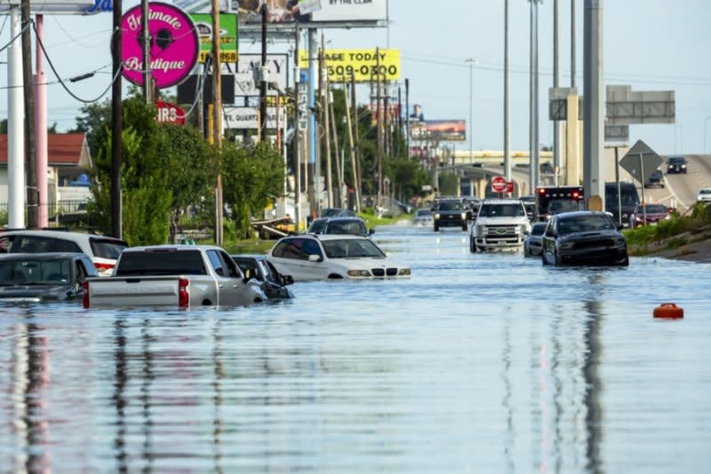 Vehicles trapped in flood waters on Monday following heavy rain from Hurricane Beryl. U.S. President Joe Biden on Tuesday granted a federal emergency disaster declaration to help speed recovery efforts in 121 Texas counties that were affected by Hurricane Beryl. Photo Provided by Carlos Ramirez/EPA-EFE