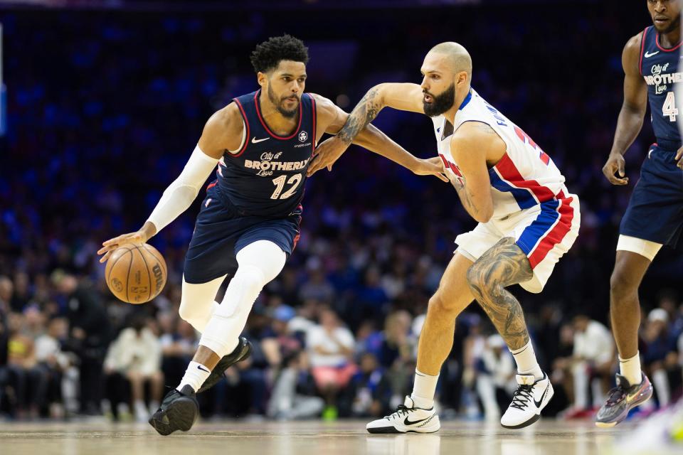 76ers forward Tobias Harris dribbles the ball against Pistons guard Evan Fournier during the second quarter on Tuesday, April 9, 2024, in Philadelphia.