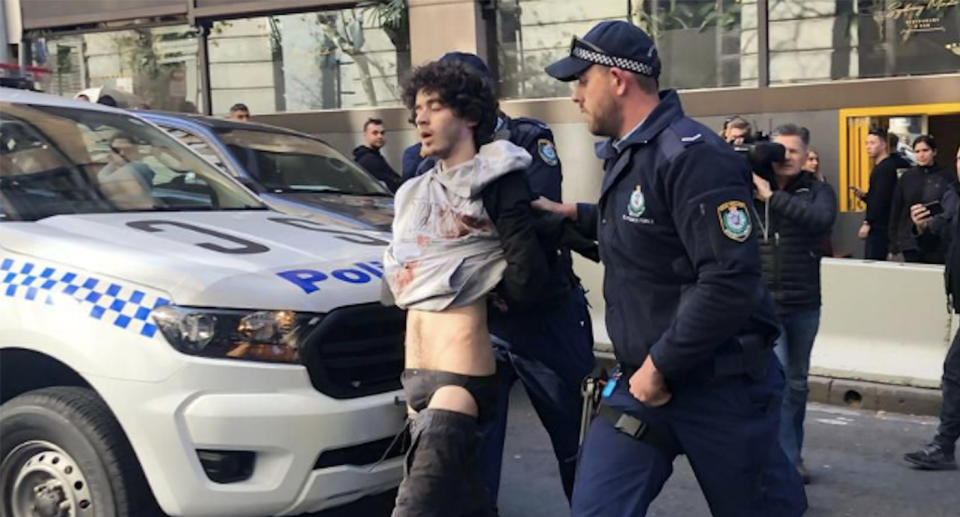 Mert Ney was pinned down by bystanders wielding chairs and a milk crate after an alleged rampage in mid-August. Source: AAP