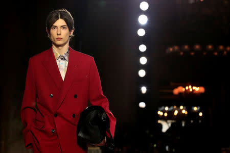 A model presents a creation by designer Kris Van Assche as part of his Fall/Winter 2019-2020 collection show for fashion house Berluti during Men's Fashion Week in Paris, France, January 18, 2019. REUTERS/Gonzalo Fuentes