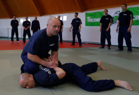 Hungarian border hunter recruits learn judo moves during a training near the border crossing point in Barcs, Hungary March 8, 2017. REUTERS/Laszlo Balogh