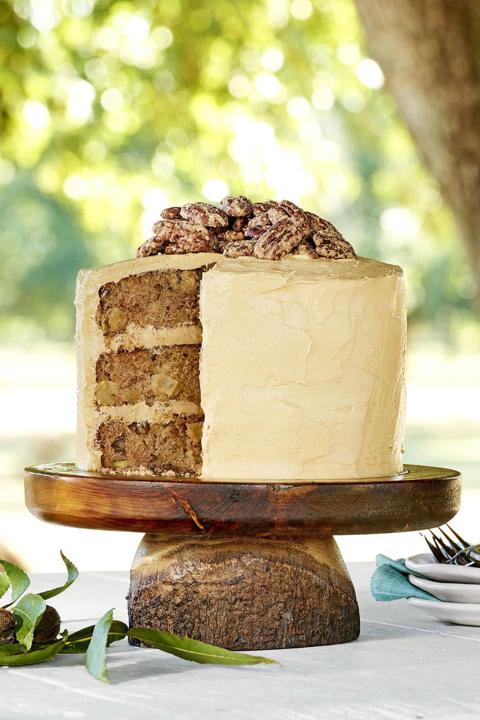 <p>Candied pecans are a beautiful topping to this three-layer cake. </p><p><strong><a href="https://www.countryliving.com/food-drinks/recipes/a45302/apple-cinnamon-layer-cake-with-salted-caramel-frosting-recipe/" rel="nofollow noopener" target="_blank" data-ylk="slk:Get the recipe;elm:context_link;itc:0;sec:content-canvas" class="link ">Get the recipe</a>.</strong></p>