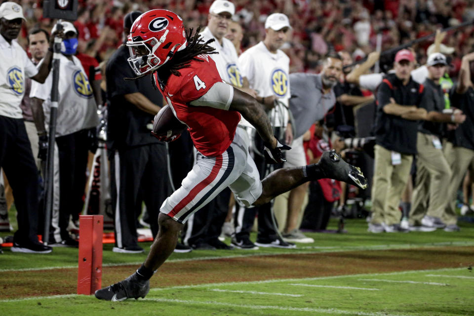 Georgia running back James Cook carries the ball in for a touchdown against South Carolina during the second half of an NCAA college football game Saturday, Sept. 18, 2021, in Athens, Ga. Georgia won 40-13. (AP Photo/Butch Dill)