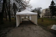 In this photo taken Wednesday, Jan. 6, 2021, an empty tent set up in front of Institute of Virology, Vaccines and Sera "Torlak" in Belgrade, Serbia. Across the Balkans and the rest of the nations in the southeastern corner of Europe, a vaccination campaign against the coronavirus is overshadowed by heated political debates or conspiracy theories that threaten to thwart the process. In countries like the Czech Republic, Serbia, Bosnia, Romania and Bulgaria, skeptics have ranged from former presidents to top athletes and doctors. Nations that once routinely went through mass inoculations under Communist leaders are deeply split over whether to take the vaccines at all. (AP Photo/Darko Vojinovic)