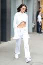 <p>In a white cropped sweatshirt, Brashy Gotland pants, white sneakers and Roberi & Fraud sunglasses while out in New York. </p>