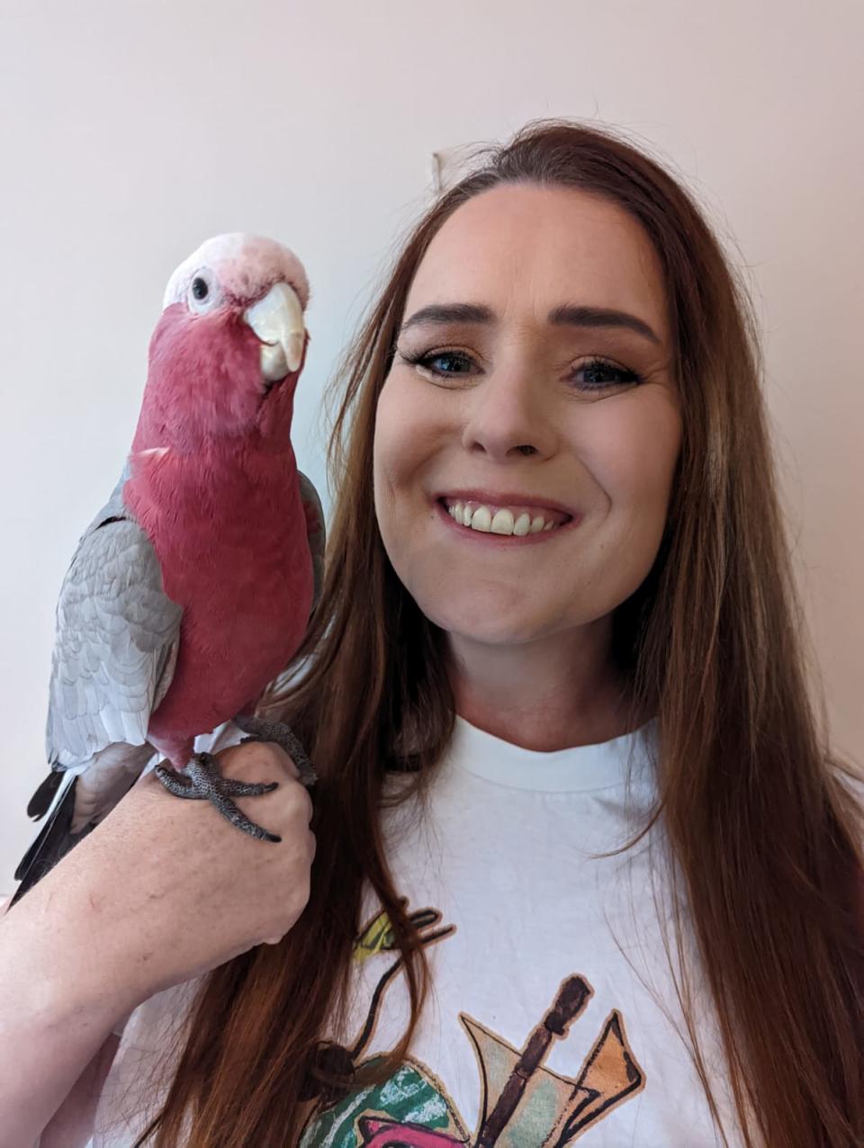 Grainne Cleary shown holding a galah.