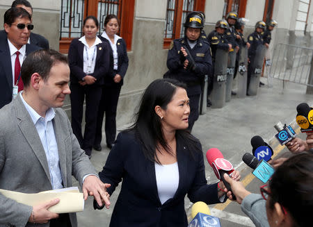 Keiko Fujimori, daughter of former president Alberto Fujimori and leader of the opposition in Peru, accompanied by her husband Mark Vito leaves the court after a hearing as part of an investigation into money laundering, in Lima, Peru October 24, 2018. REUTERS/Guadalupe Pardo