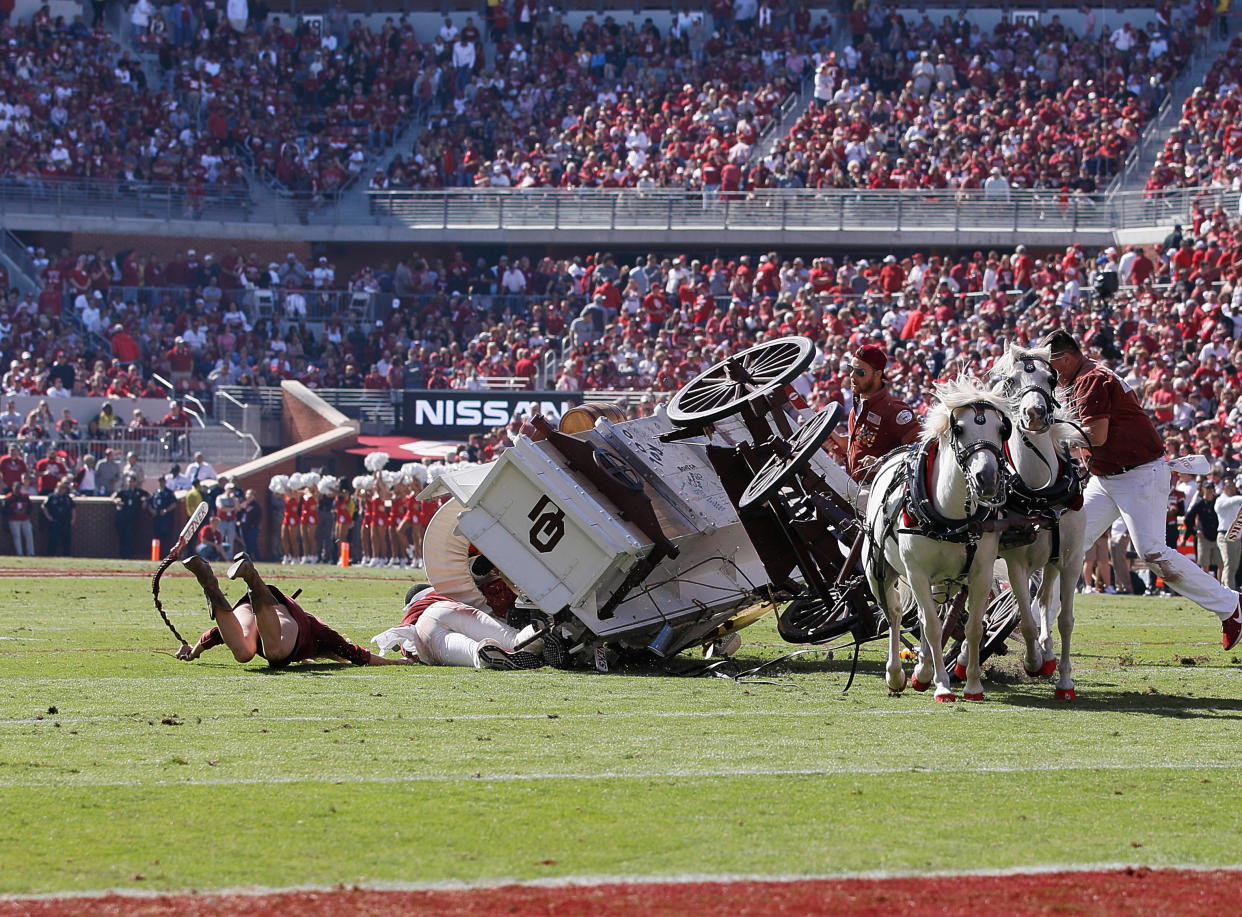 NORMAN, OK - OCTOBER 19: Oklahoma Ruf Nek's Sooner Schooner over turns after a touchdown celebration  during a college football game between the Oklahoma Sooners and the West Virginia Mountaineers on October 19, 2019, at Memorial Stadium in Norman, OK.  (Photo by David Stacy/Icon Sportswire via Getty Images)