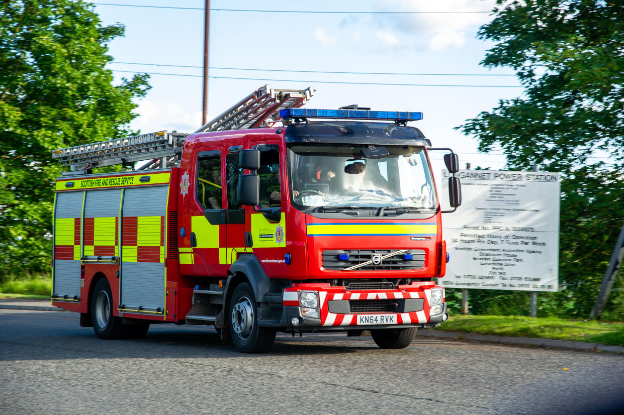  A fire crew exits from the scene.
EMS were called out to deal with a blaze that broke out at the disused Longannet Power Station near Kincardine, Fife. The blaze started at 14:50PM BST in a disused coal bunker. EMS started to leave the premises at 18:55PM BST. (Photo by Stewart Kirby / SOPA Images/Sipa USA) 