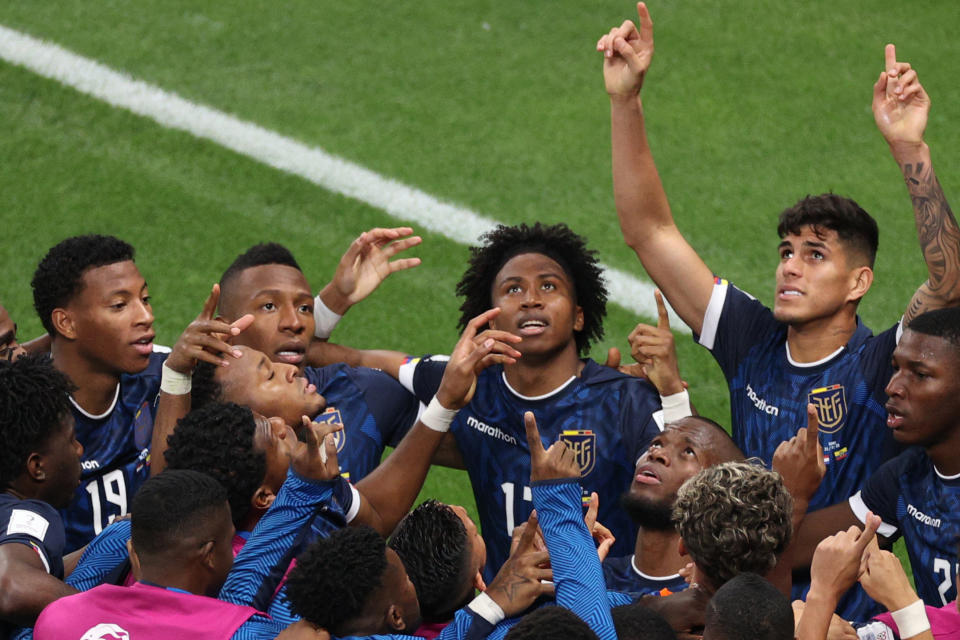 Ecuador's forward #13 Enner Valencia (C) celebrates with teammates after he scored his team's first goal during the Qatar 2022 World Cup Group A football match between the Netherlands and Ecuador at the Khalifa International Stadium in Doha on November 25, 2022. (Photo by ADRIAN DENNIS / AFP) (Photo by ADRIAN DENNIS/AFP via Getty Images)