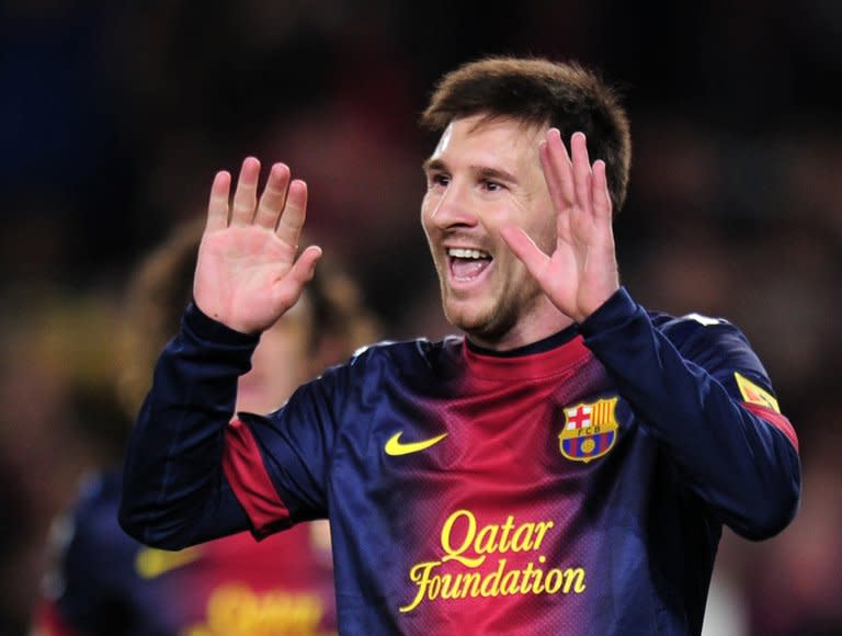 Barcelona's Lionel Messi celebrates after scoring a goal during their Spanish La Liga match against Espanyol, at the Camp Nou stadium in Barcelona, on January 6, 2013. Barcelona may be 11 points ahead of their nearest rivals, Atletico Madrid, but Messi, who this week won his fourth consecutive Ballon d'Or, is keeping his feet on the ground regarding the title race