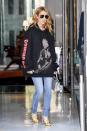 <p>In a Vetements sweatshirt (fittingly emblazoned with a <em>Titanic</em> graphic), jeans, and gold heels leaving the Royal Monceau hotel.</p>