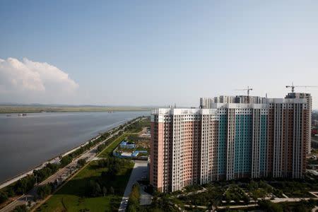 A general view shows the largely empty New Zone urban development at the Yalu River in Dandong, Liaoning province, China September 11, 2016. REUTERS/Thomas Peter
