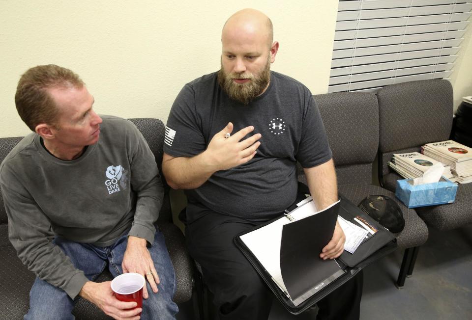 In this Wednesday, Dec. 7, 2016 photo, U.S. Army Veteran Richard Ress, right, speaks during a bible group meeting at his rural church in Grayson County, Texas. Ress participates in a traveling veterans court with Judge John Roach Jr. The traveling court serves veterans in five counties near Dallas who don’t have transportation. Veterans say the opportunity is life-changing. (AP Photo/LM Otero)