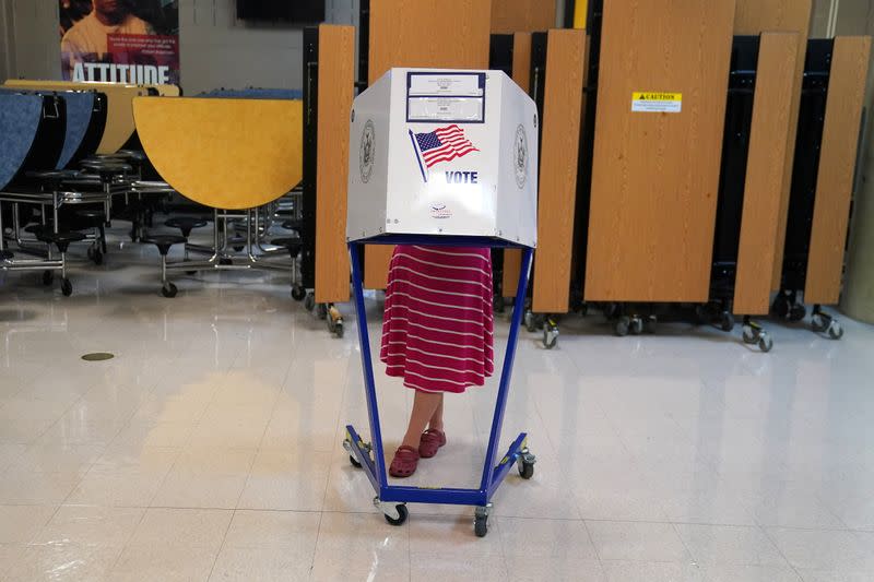 A woman votes at a polling place in the Bronx borough of New York City