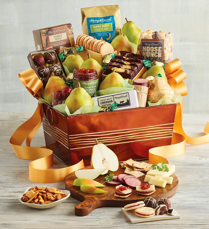 <p><a href="https://clicks.trx-hub.com/xid/hearstcorp_9eb67_tpw?q=https%3A%2F%2Fwww.harryanddavid.com%2Fh%2Fgift-baskets-tower-boxes%2Fall-occasion-gift-baskets%2F33038%3Fref%3Dshopzilla%26utm_medium%3Dcse%26utm_source%3Dshopzilla%26cnxclid%3D16303416206570814318810070301008005&p=https%3A%2F%2Fwww.thepioneerwoman.com%2Fholidays-celebrations%2Fgifts%2Fg37433020%2Ffood-gift-baskets%2F&utmSource=yahoo-us&utmCampaign=3208&utmMedium=syn" rel="nofollow noopener" target="_blank" data-ylk="slk:Shop Now;elm:context_link;itc:0;sec:content-canvas" class="link ">Shop Now</a></p><p>Grand Favorites Gift Basket</p><p>$149.99</p><p>harryanddavid.com</p><span class="copyright">Harry & David</span>