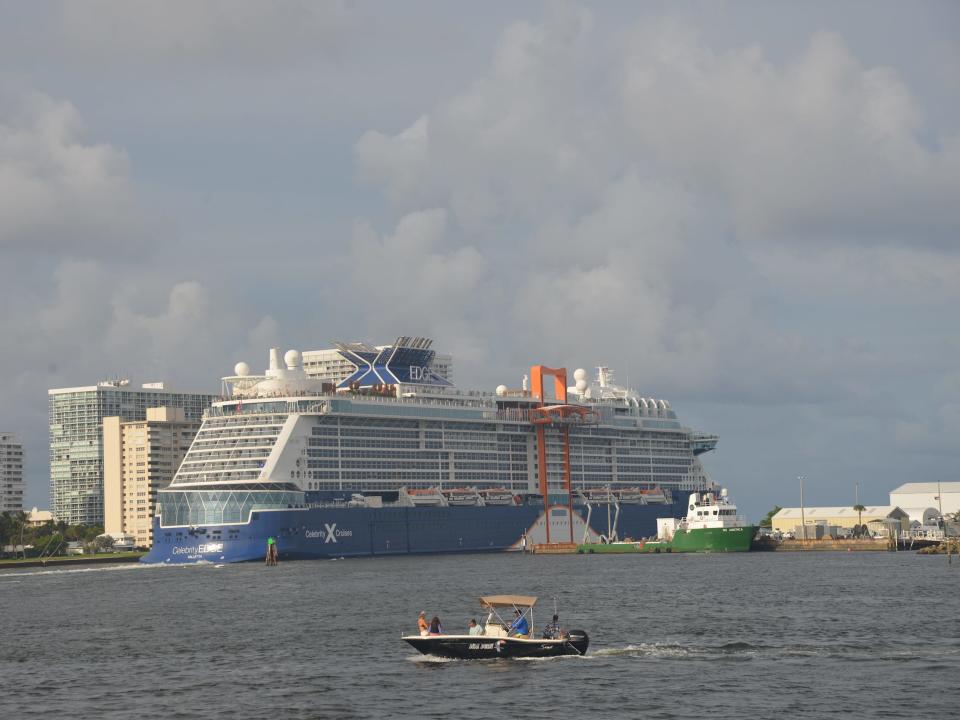 the Celebrity Edge sailing away from Port Everglades in Florida with other boats nearby.