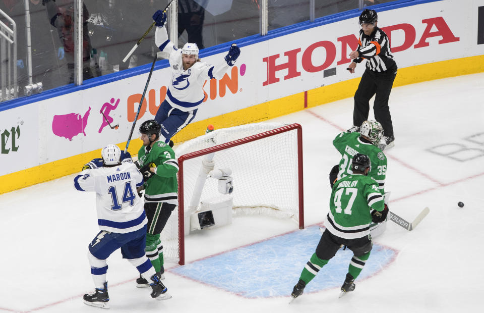 Tampa Bay Lightning center Steven Stamkos, top left, celebrates his goal against Dallas Stars goaltender Anton Khudobin (35) during the first period of Game 3 of the NHL hockey Stanley Cup Final, Wednesday, Sept. 23, 2020, in Edmonton, Alberta. (Jason Franson/The Canadian Press via AP)