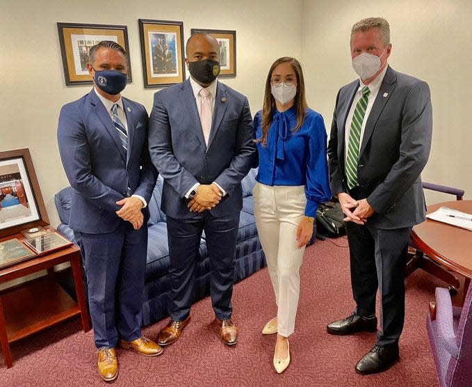 Palm Beach County School District Chief of Staff Jay Boggess, Sen. Bobby Powell, Jr., school board member Alexandria Ayala and Superintendent Mike Burke together Jan. 11, 2022.