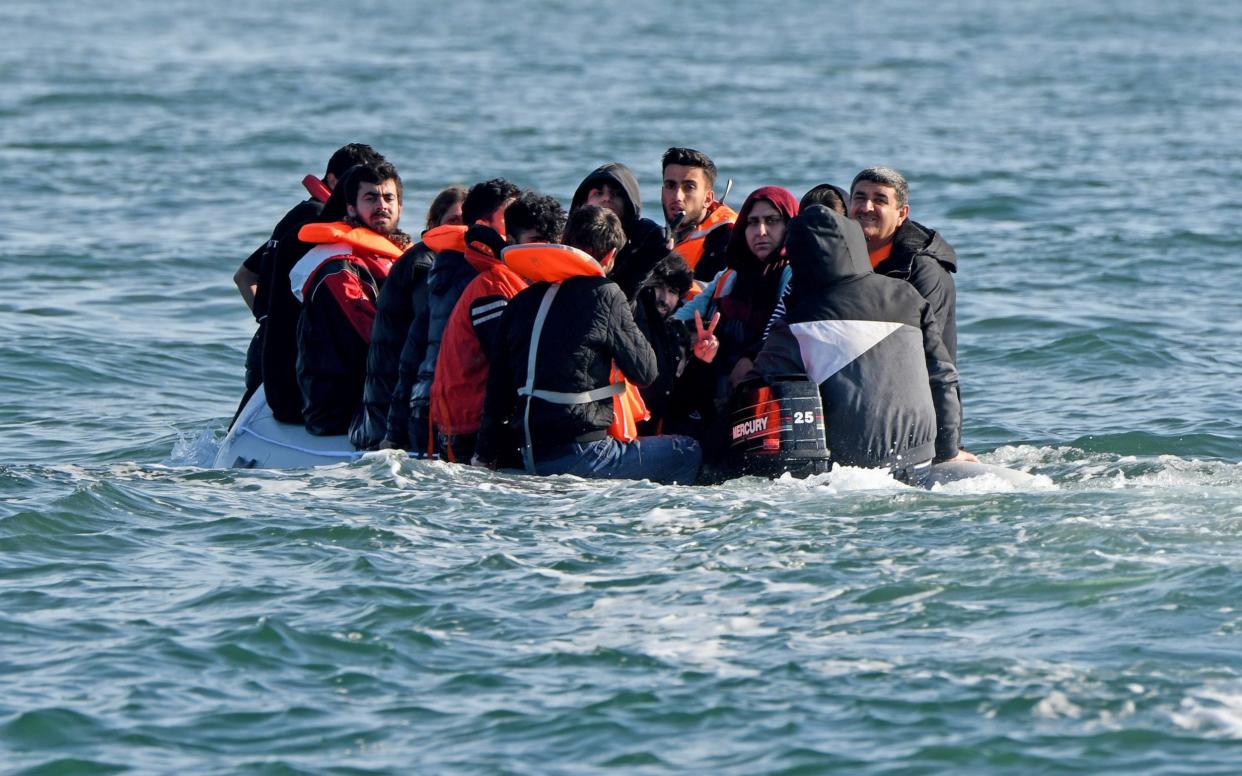 A small boat carrying migrants in the English Channel last month. - Steve Finn/Steve Finn Photography