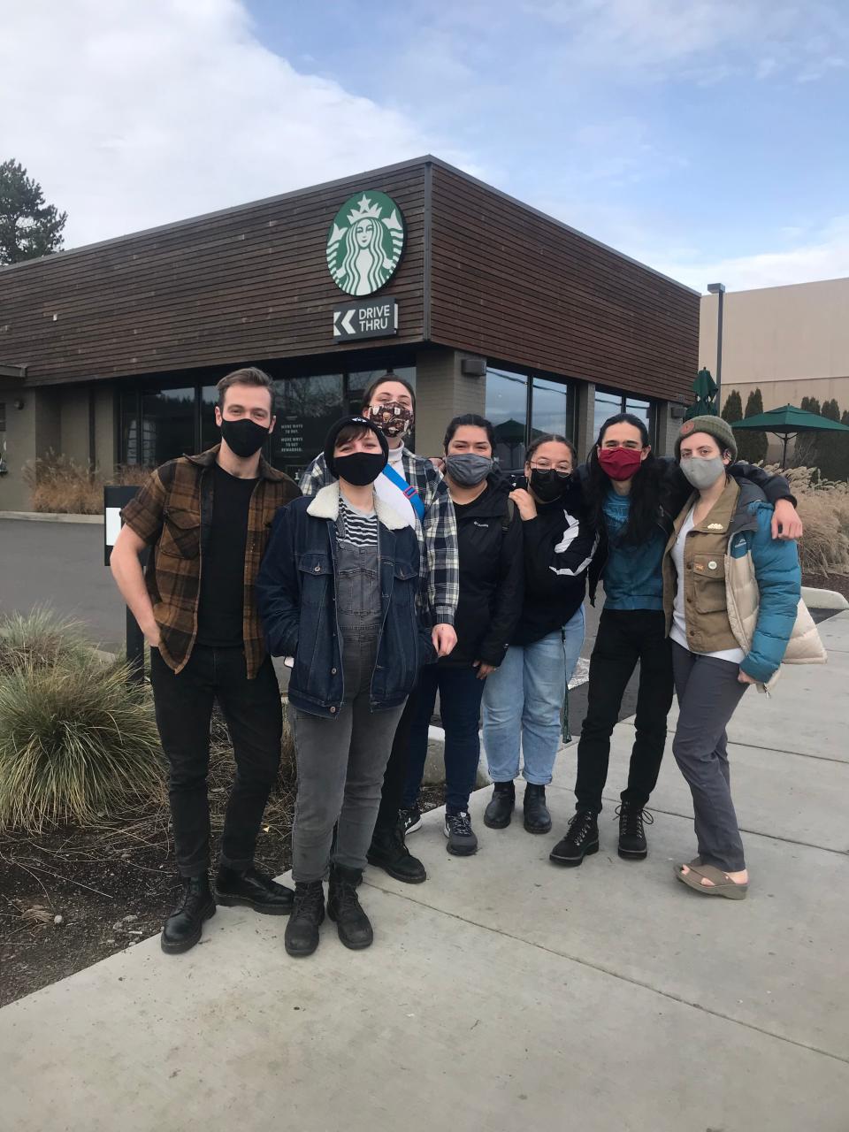 South Eugene Starbucks workers Jake LaMourie, from left, Bex Littleton, Marie Alexander, Jazmin Espinoza, Janessa Voyce, Quentin J. Piccolo and Ky Fireside stand outside their workplace at 2830 Willamette St. The workers are petitioning to get unionized.