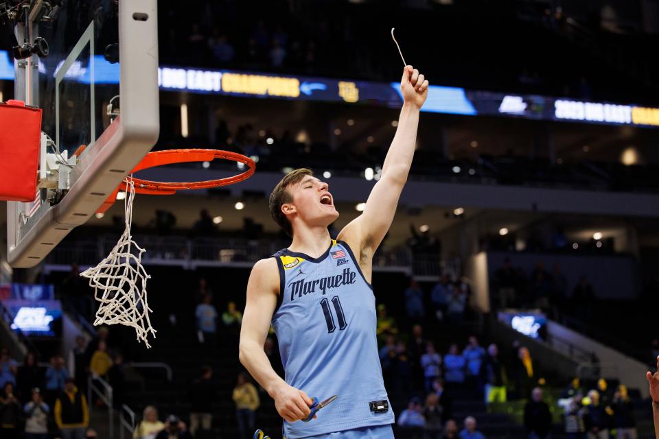Mar 4, 2023; Milwaukee, Wisconsin, USA;  Marquette Golden Eagles guard Tyler Kolek (11) celebrates winning the Big East Conference Regular Season Championship  after cutting down the net following the game against the St. John's Red Storm at Fiserv Forum. Mandatory Credit: Jeff Hanisch-USA TODAY Sports