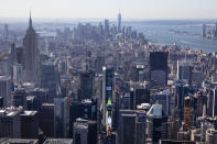 The view from an upper floor of the Central Park Tower shows Times Square, lower center, the Empire State Building, left, and One World Trade Center, center background, Tuesday, Sept. 17, 2019 in New York. At 1550 feet (472 meters) the tower is the world's tallest residential apartment building, according to the developer, Extell Development Co. (AP Photo/Mark Lennihan)