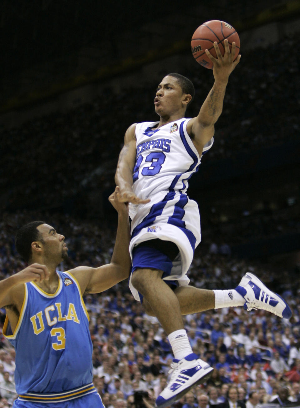 FILE - Memphis' Derrick Rose goes to the basket against UCLA's Josh Shipp (3) during the first half of a semifinal game at the NCAA college basketball Final Four in San Antonio, April 5, 2008. (AP Photo/Eric Gay, File)