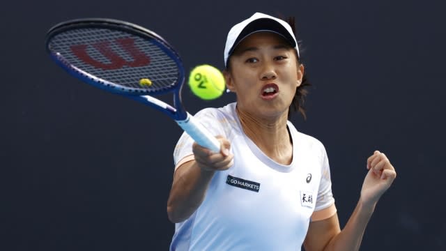 Zhang Shuai of China plays a forehand return.