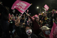 A supporter of Taiwan Democratic Progressive Party (DPP) presidential candidate wearing a mask with the United States flag cheers during a rally in Taipei, Taiwan on Thursday, Jan. 11, 2024 ahead of the presidential election on Saturday. Washington's relationship with Beijing will face its biggest test since the leaders of the two countries met in November, as the United States seeks to keep the Taiwan Straits calm after Taiwanese voters select a new president this weekend. (AP Photo/Ng Han Guan)