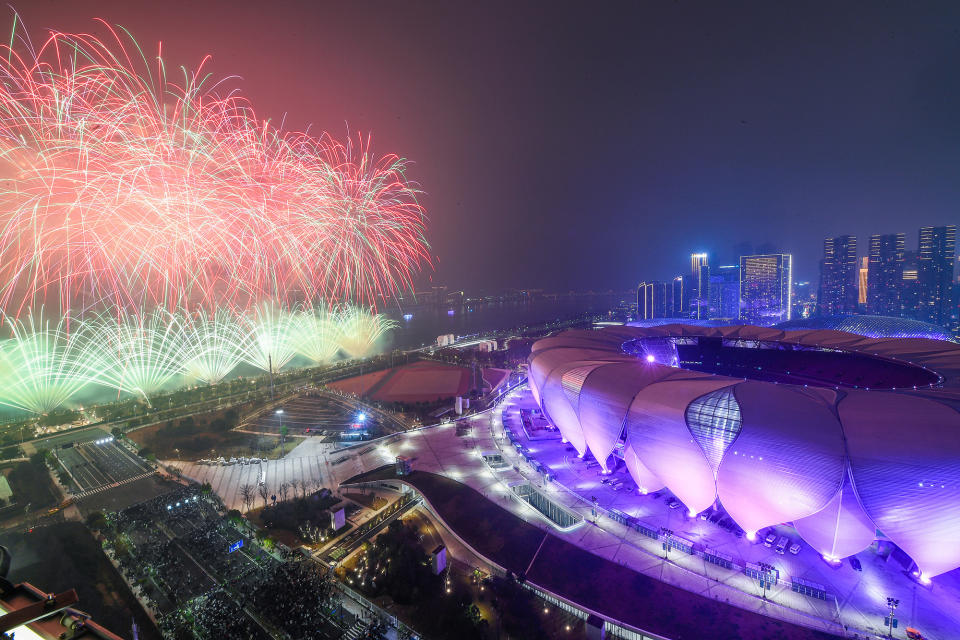 Fireworks explode over the Hangzhou Olympic Sports Center, nicknamed 