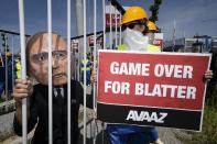 A demonstrator disguised as FIFA President Sepp Blatter takes part in a protest against the condition of workers in Qatar, on the sidelines of the 65th FIFA Congress on May 28, 2015 in Zurich