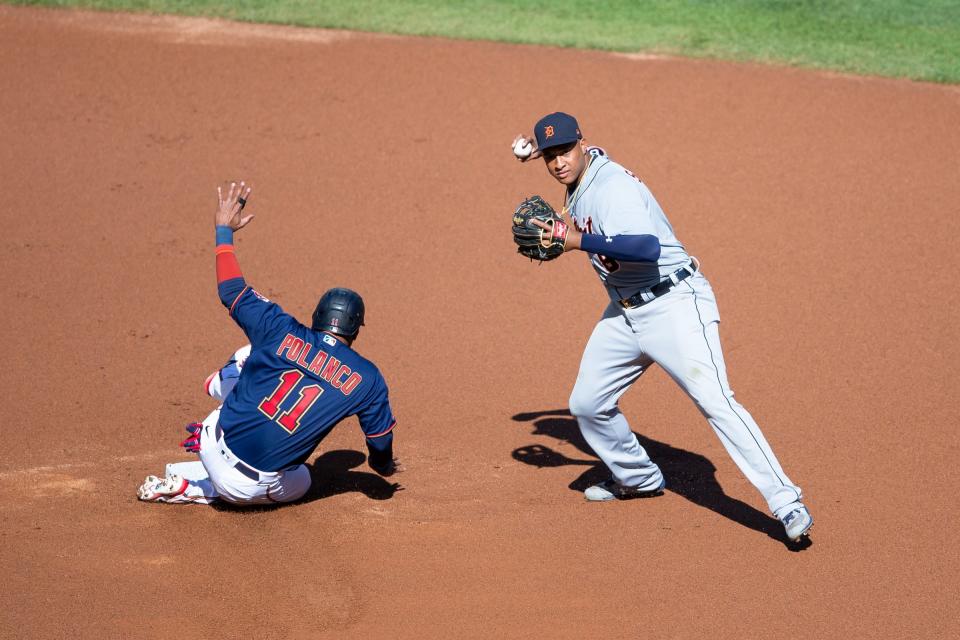 Detroit Tigers second baseman Jonathan Schoop turns a double play in the first inning against Minnesota Twins shortstop Jorge Polanco at Target Field, Sept. 4, 2020.